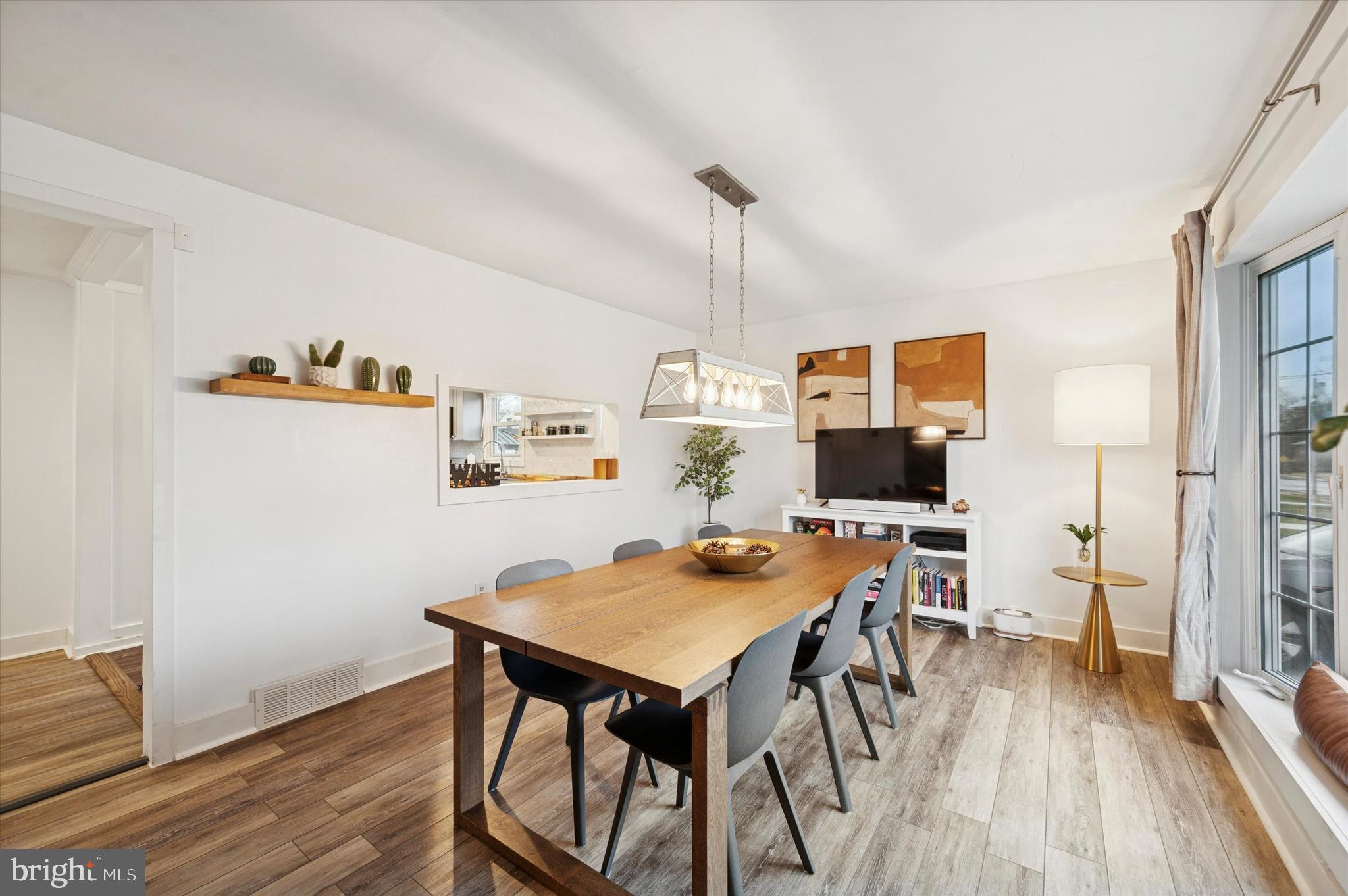 508 5th Avenue Barrington, NJ 08007 - Photo 3 of 28 a view of a workspace with furniture and wooden floor