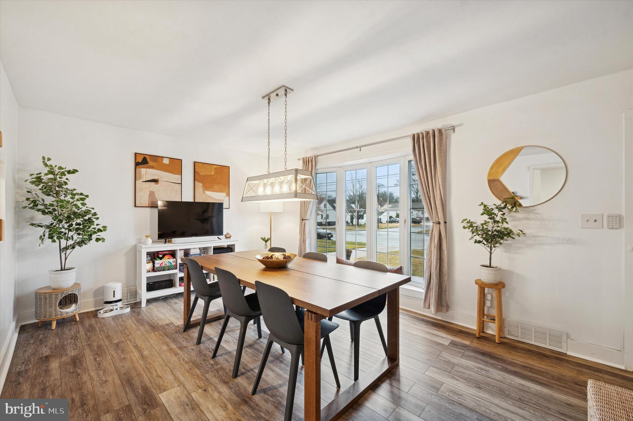508 5th Avenue Barrington, NJ 08007 - Photo 4 of 28 a view of a dining room with furniture window and wooden floor