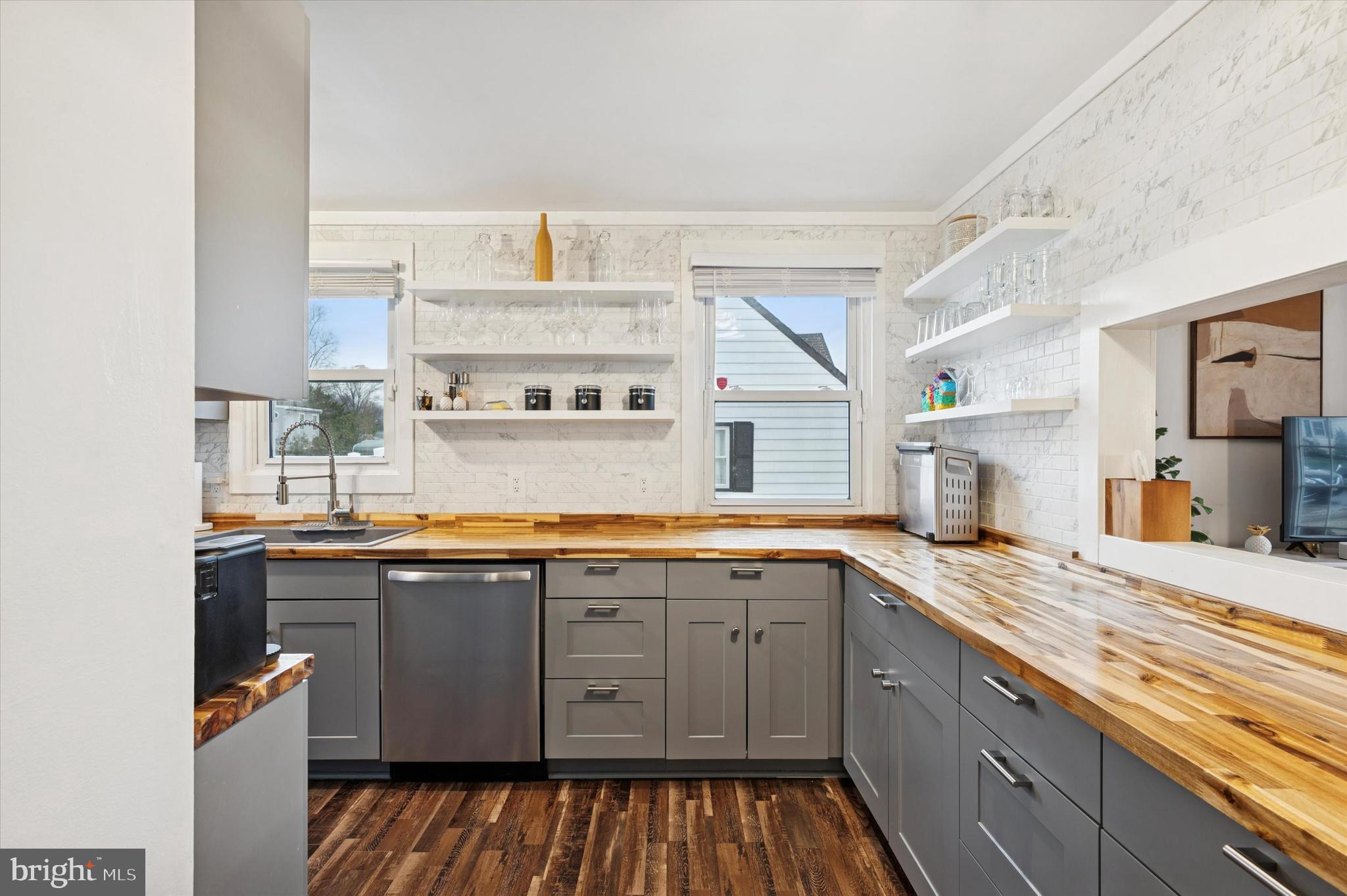 508 5th Avenue Barrington, NJ 08007 - Photo 7 of 28 a kitchen with a sink stove and cabinets