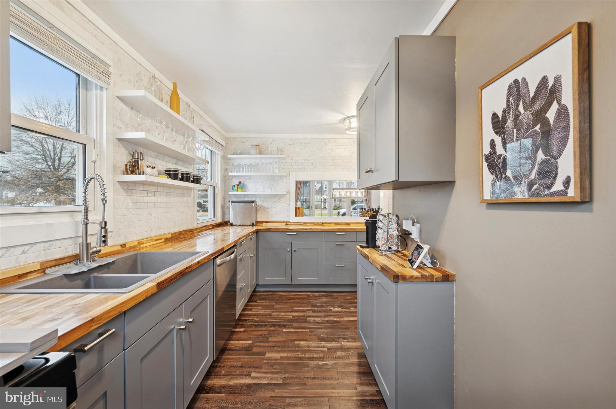 508 5th Avenue Barrington, NJ 08007 - Photo 8 of 28 a kitchen with stainless steel appliances granite countertop a sink and cabinets