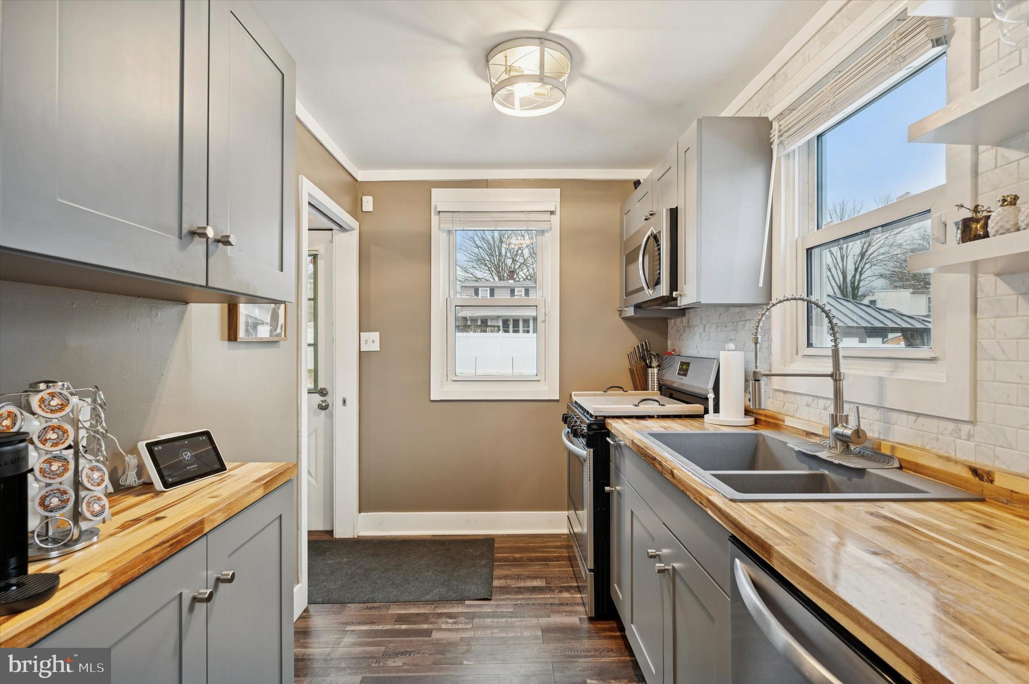 508 5th Avenue Barrington, NJ 08007 - Photo 9 of 28 a kitchen that has a sink and a stove