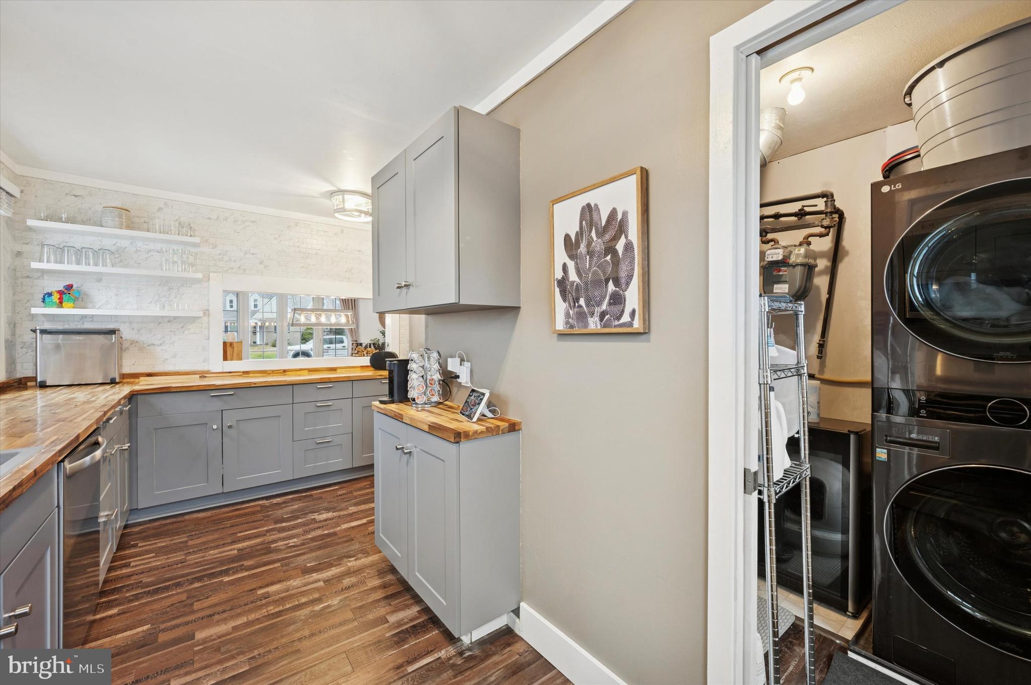 508 5th Avenue Barrington, NJ 08007 - Photo 10 of 28 a kitchen with stainless steel appliances wooden cabinets and a stove top oven