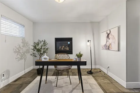 a view of a workspace with furniture