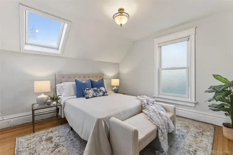 a bedroom with bed and a window