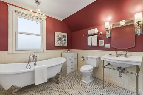 a bathroom with a double vanity sink mirror and toilet