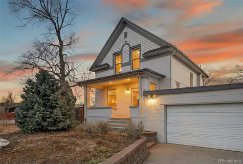 a bathroom with a sink mirror and toilet