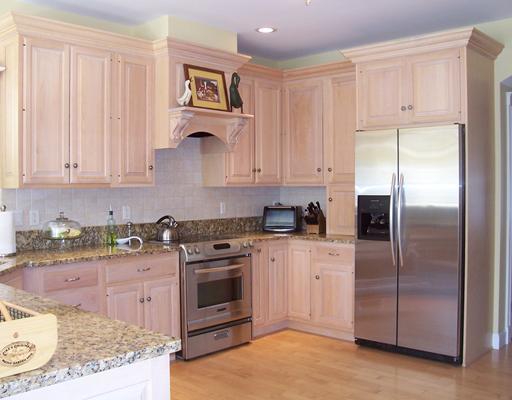Kitchen. Cabinetry features crown...