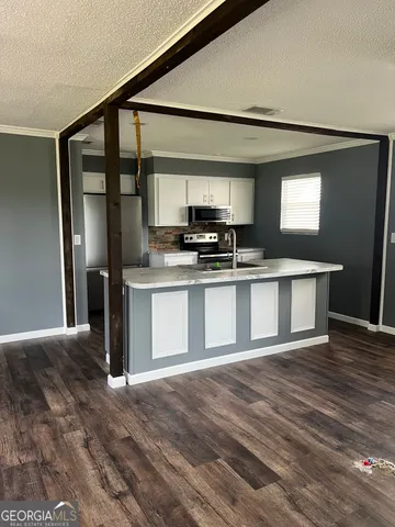 a kitchen with sink and window