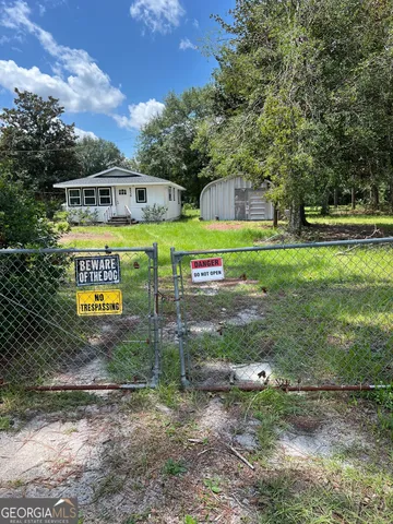 a view of a park with large trees