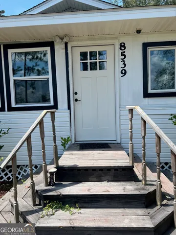 a view of entryway with wooden floor