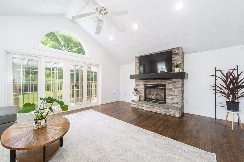 17 Lindsay Road Billerica, MA 01821 - Photo 13 of 42 a living room with furniture a fireplace and a flat screen tv