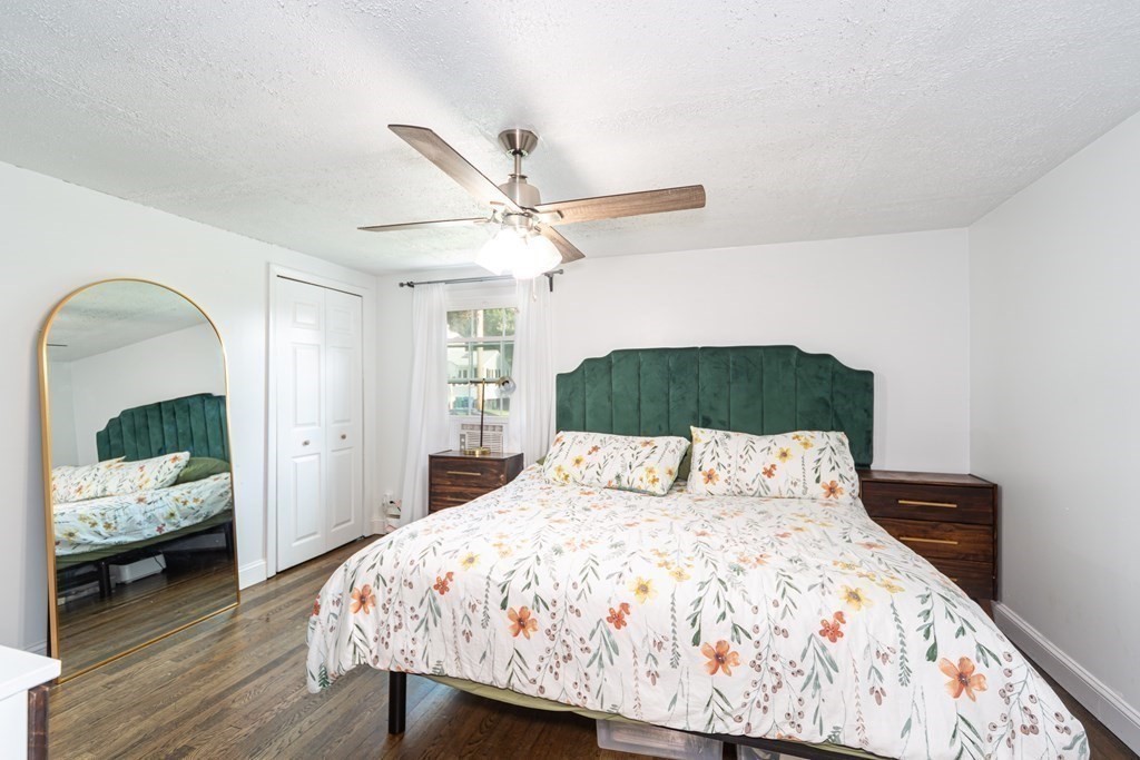 17 Lindsay Road Billerica, MA 01821 - Photo 17 of 42 a bedroom with a bed and a chandelier