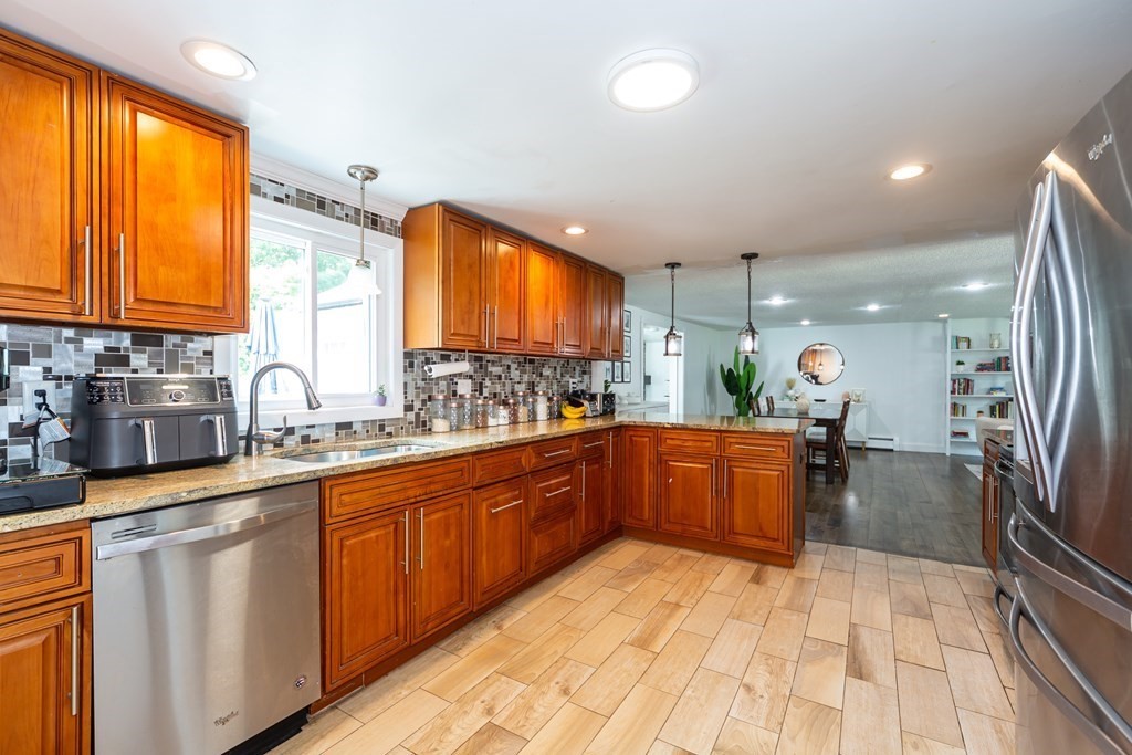 17 Lindsay Road Billerica, MA 01821 - Photo 3 of 42 a kitchen with stainless steel appliances granite countertop a sink and cabinets