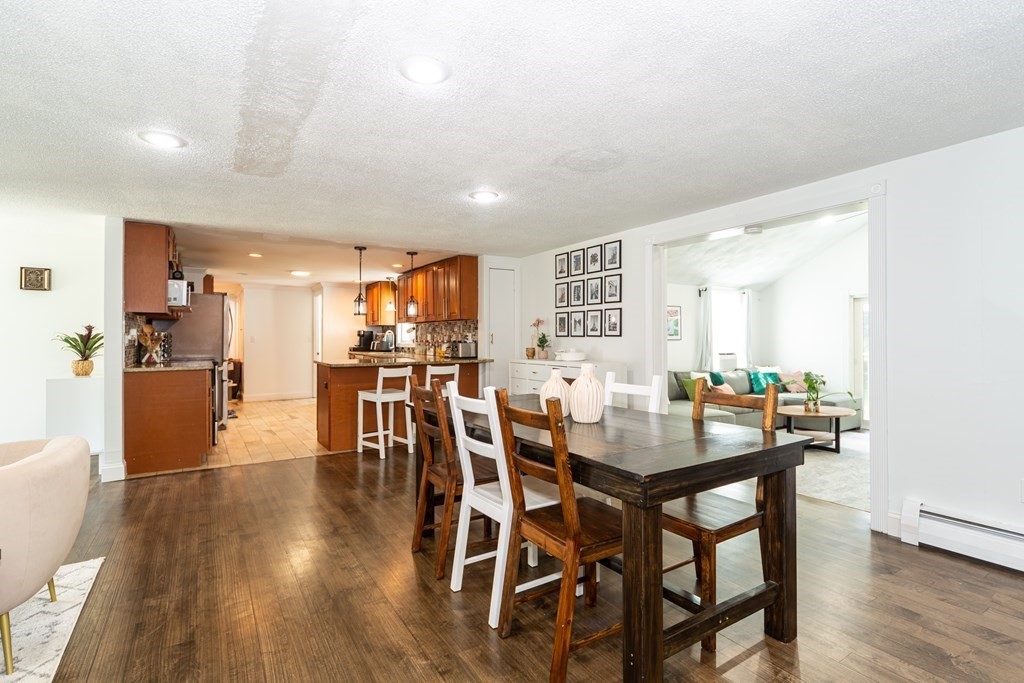 17 Lindsay Road Billerica, MA 01821 - Photo 6 of 42 a view of a dining room with furniture and wooden floor
