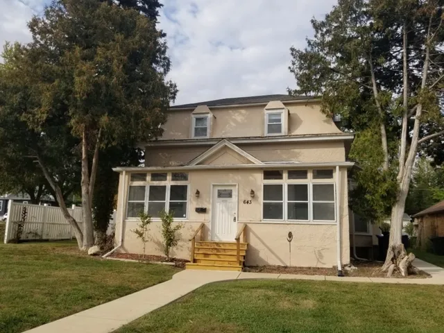 front view of a house with a yard