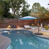 a swimming pool with outdoor seating