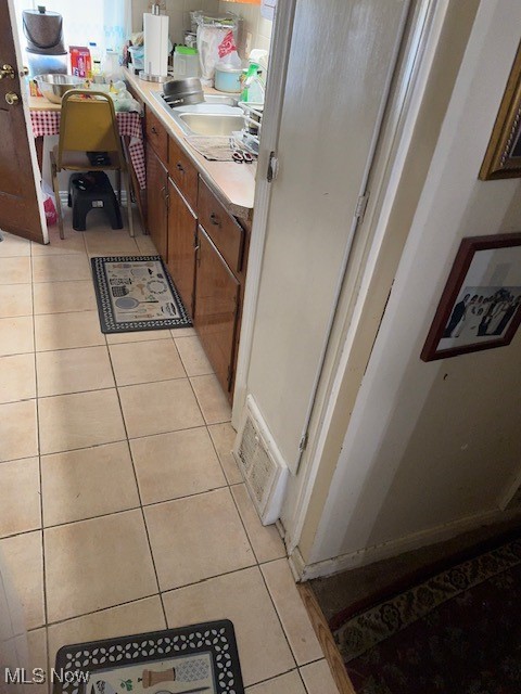 16319 Greyton Road Cleveland, OH 44112 - Photo 13 of 20 Bathroom featuring tile patterned floors and vanity