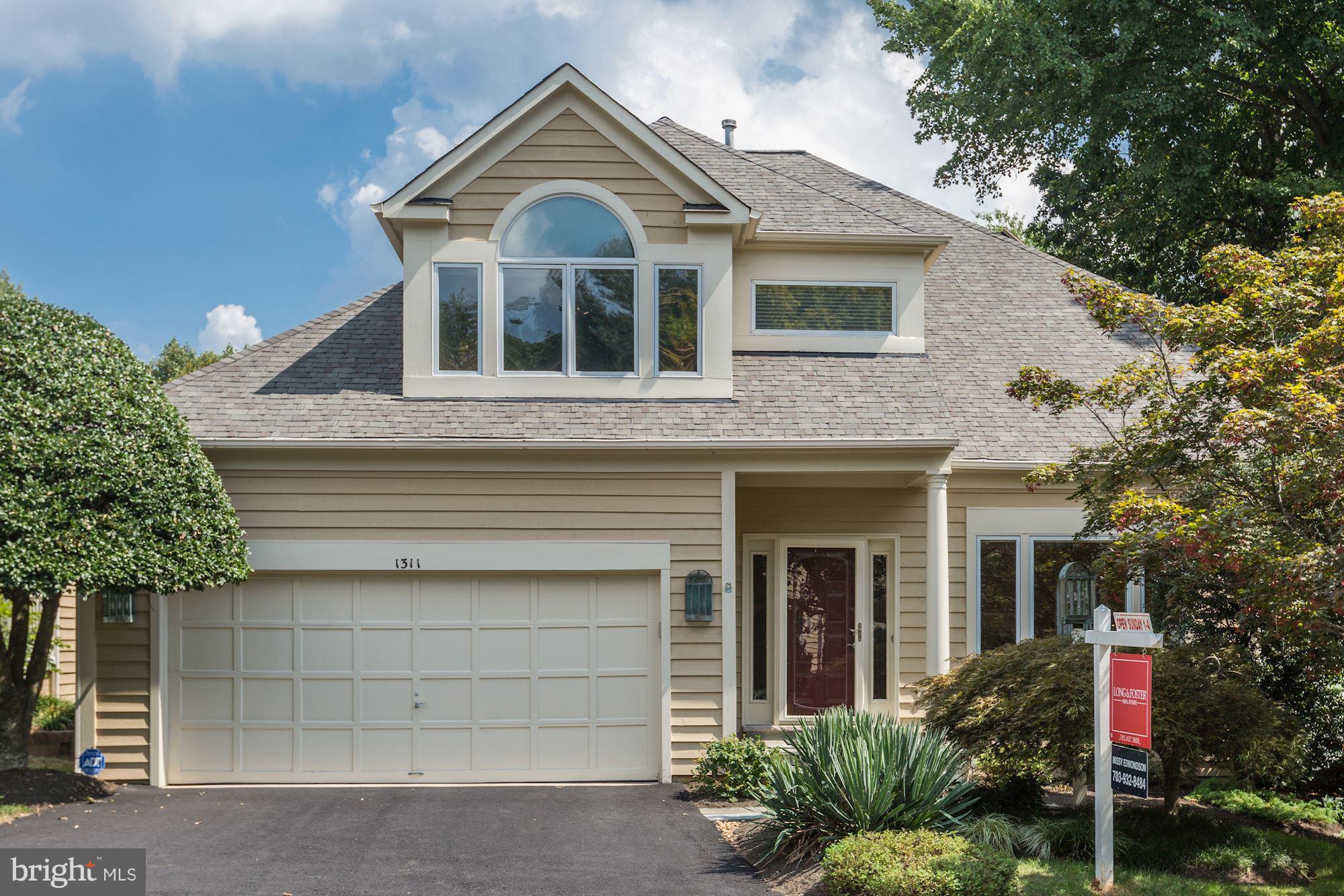1311 Pavilion Club Way Reston, VA 20194 - Photo 1 of 28 a front view of a house with a yard