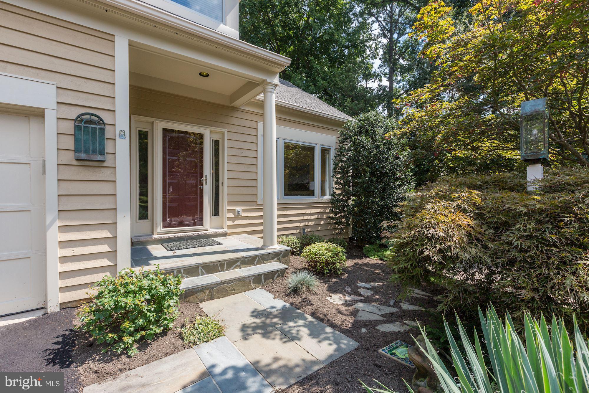1311 Pavilion Club Way Reston, VA 20194 - Photo 2 of 28 a front view of a house with a yard