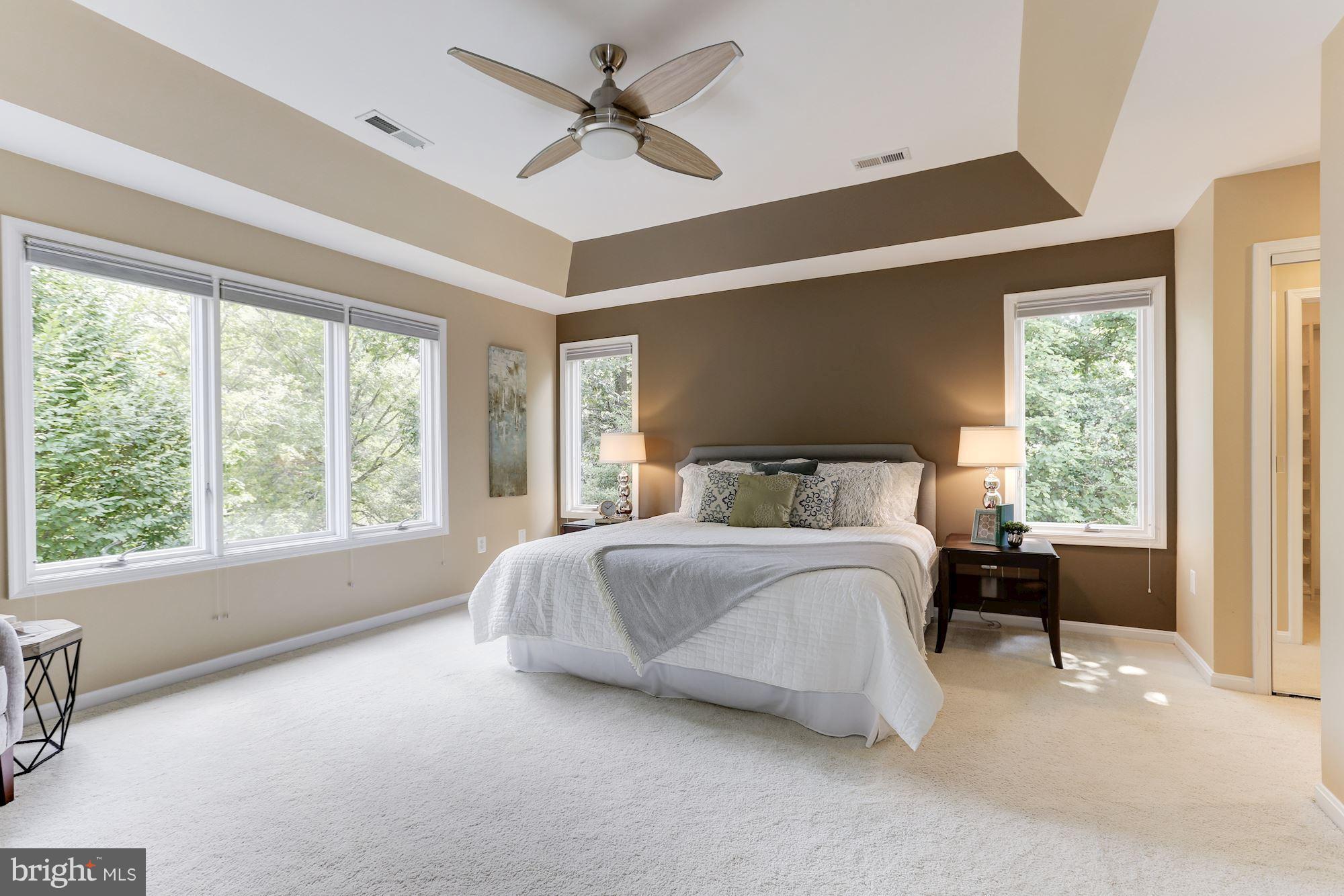 1311 Pavilion Club Way Reston, VA 20194 - Photo 14 of 28 a spacious bedroom with a large bed and a large window