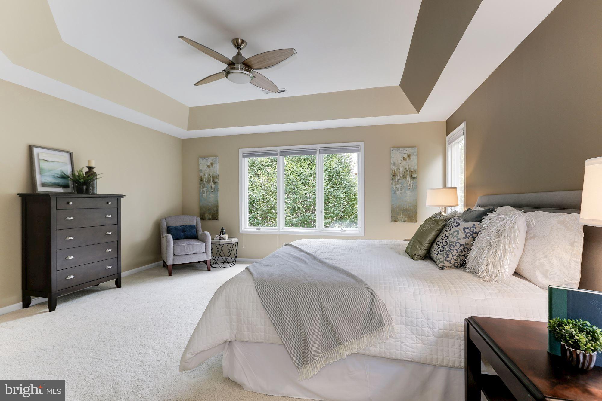 1311 Pavilion Club Way Reston, VA 20194 - Photo 15 of 28 a bedroom with a bed a couch and a dresser