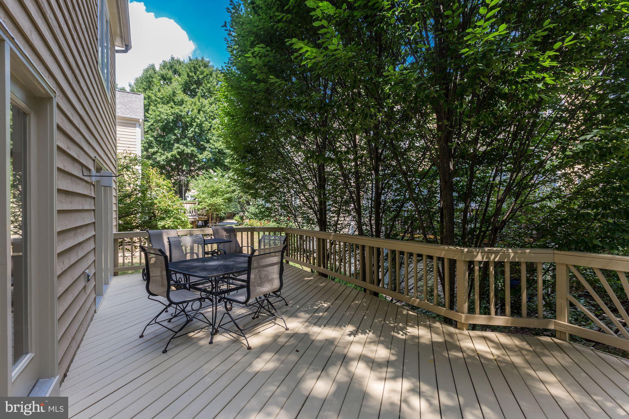 1311 Pavilion Club Way Reston, VA 20194 - Photo 25 of 28 a view of balcony with wooden floor and outdoor seating