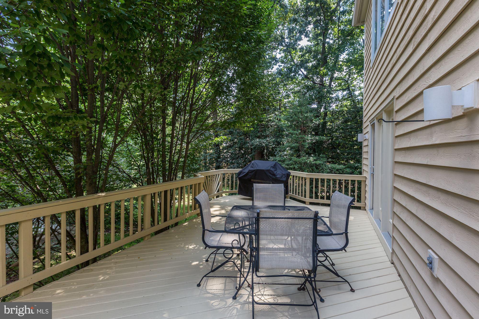 1311 Pavilion Club Way Reston, VA 20194 - Photo 26 of 28 a view of a deck with chairs and wooden floor