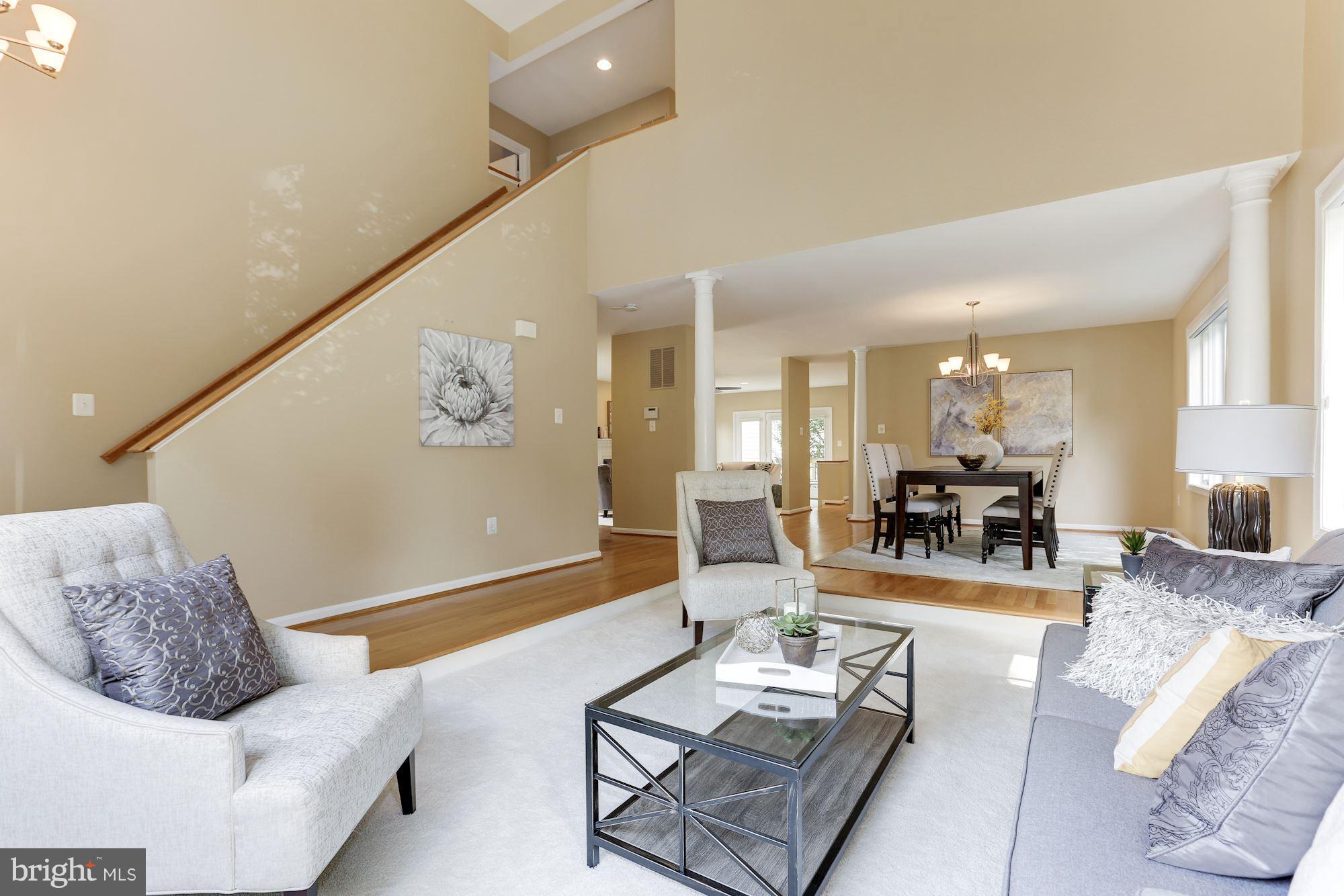 1311 Pavilion Club Way Reston, VA 20194 - Photo 4 of 28 a living room with furniture and wooden floor