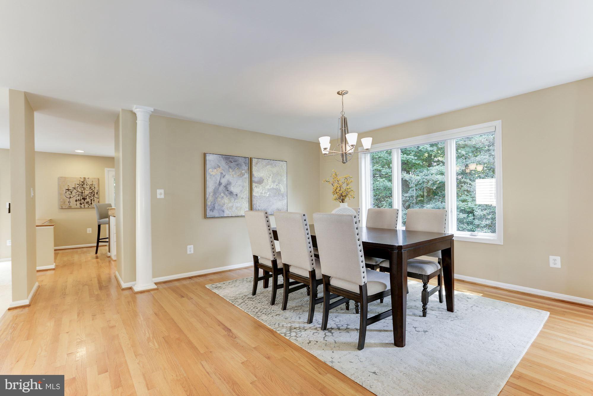1311 Pavilion Club Way Reston, VA 20194 - Photo 5 of 28 a view of a dining room with furniture and wooden floor