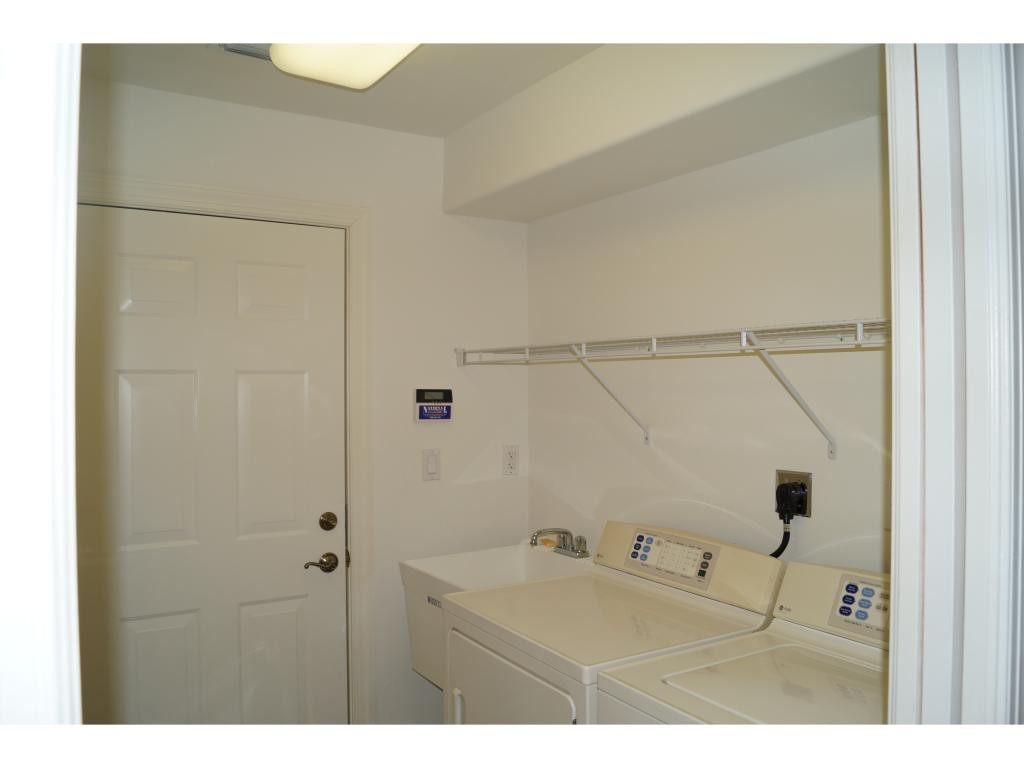 1286 Rialto Way, Unit 102 Naples, FL 34114 - Photo 16 of 17 Laundry with tub