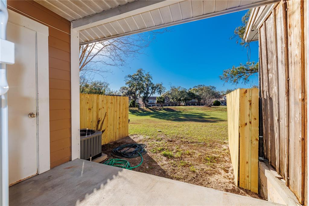 6922 Woodlake Drive, Unit 103 Orlando, FL 32810 - Photo 14 of 16 a view of a house with a ocean view