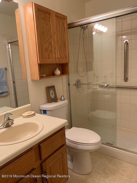 5A Mill Road, Unit C Whiting, NJ 08759 - Photo 4 of 7 a bathroom with a sink a toilet and shower