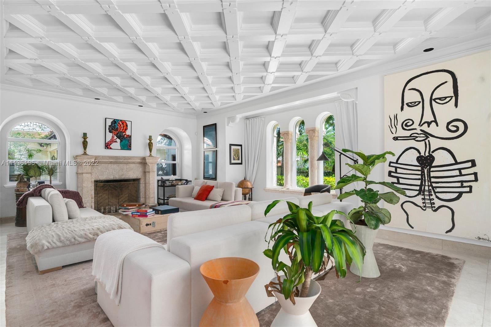 a living room with patio furniture