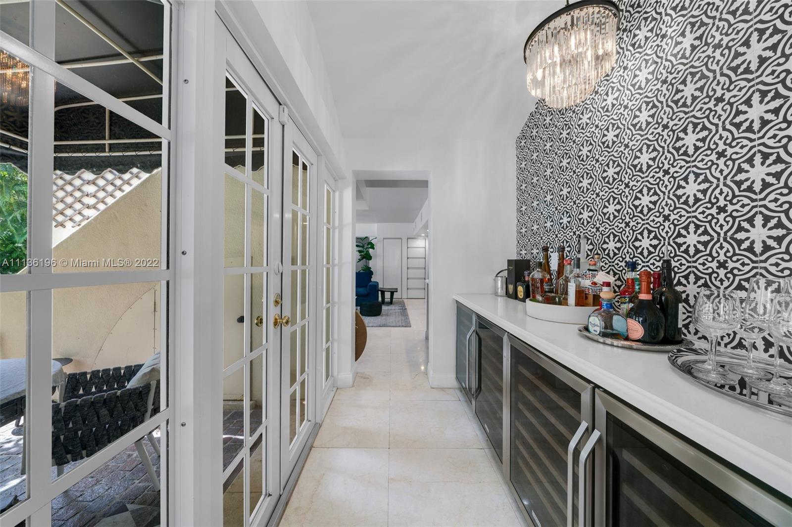 5852 Pine Tree Drive Miami Beach, FL 33140 - Photo 17 of 53 a kitchen with sink cabinets and furniture