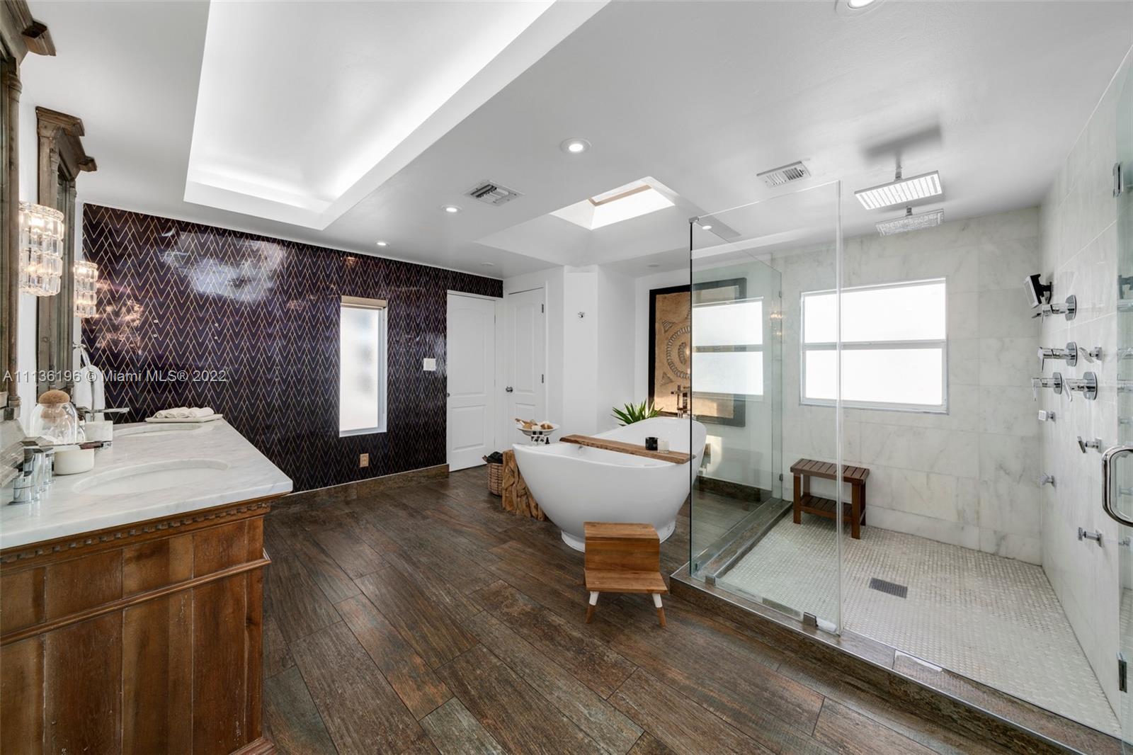 5852 Pine Tree Drive Miami Beach, FL 33140 - Photo 24 of 53 a living room with furniture a window and a table