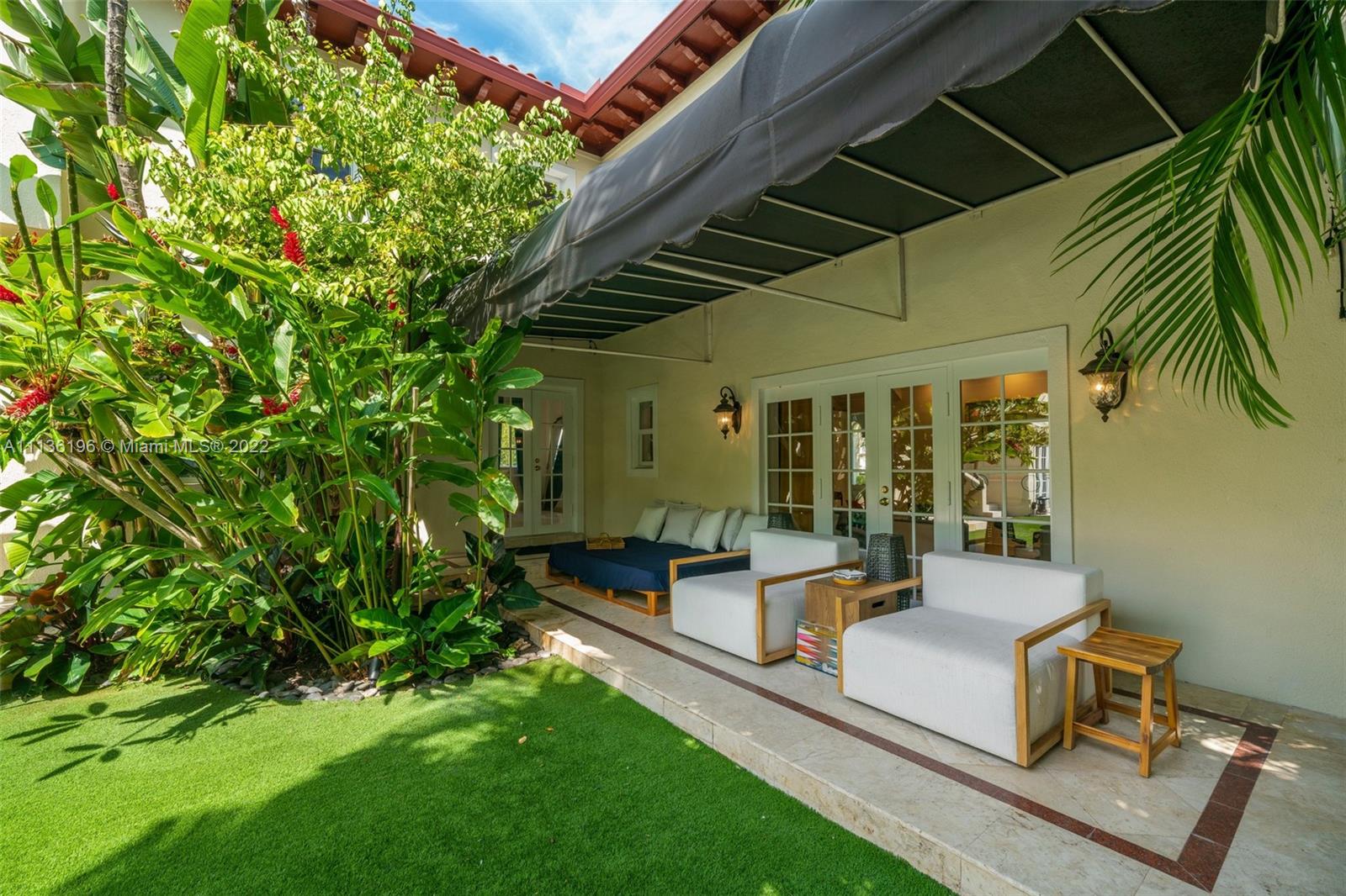 5852 Pine Tree Drive Miami Beach, FL 33140 - Photo 40 of 53 a house view with sitting space and garden space