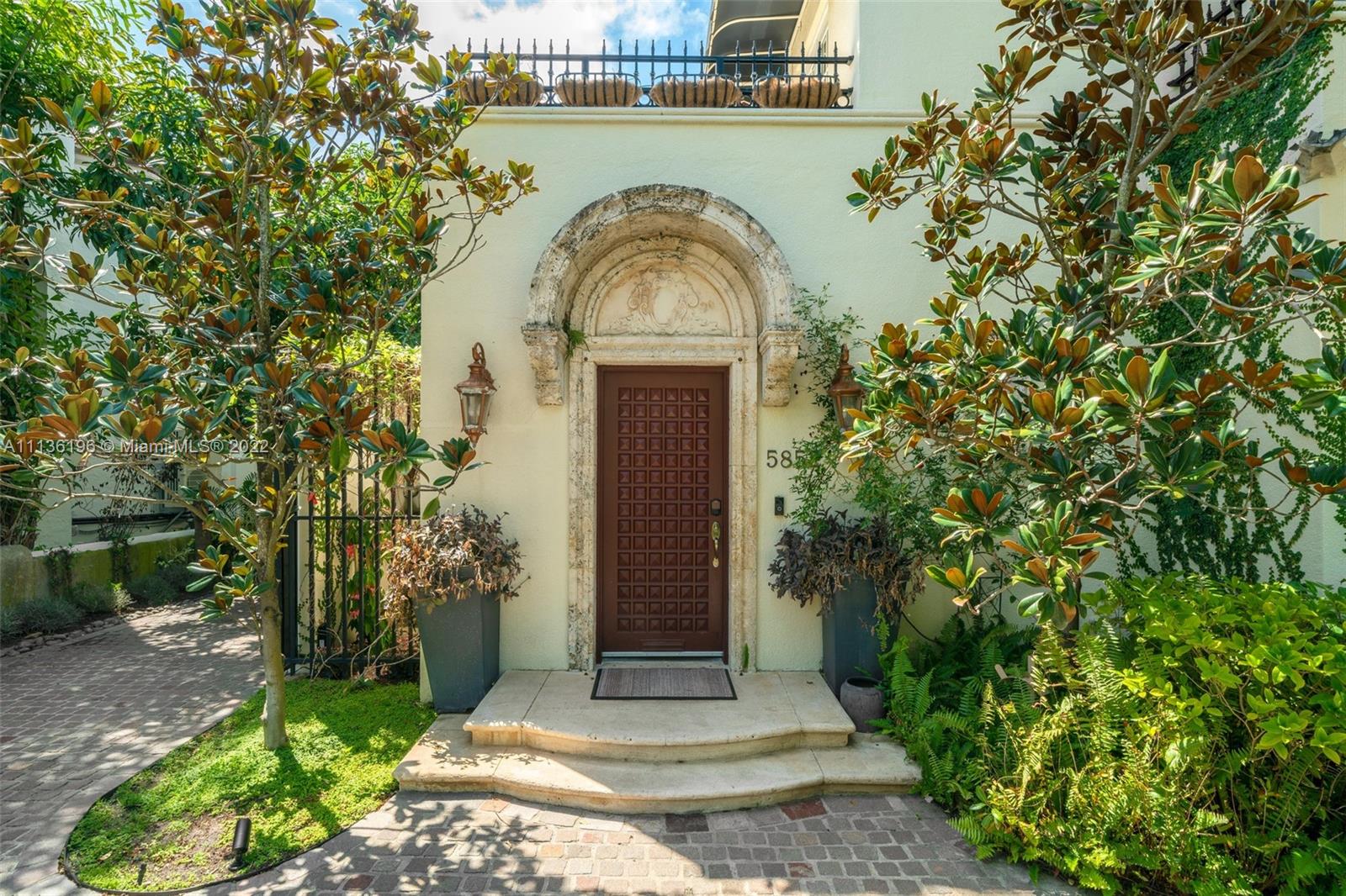5852 Pine Tree Drive Miami Beach, FL 33140 - Photo 48 of 53 a house with a outdoor space