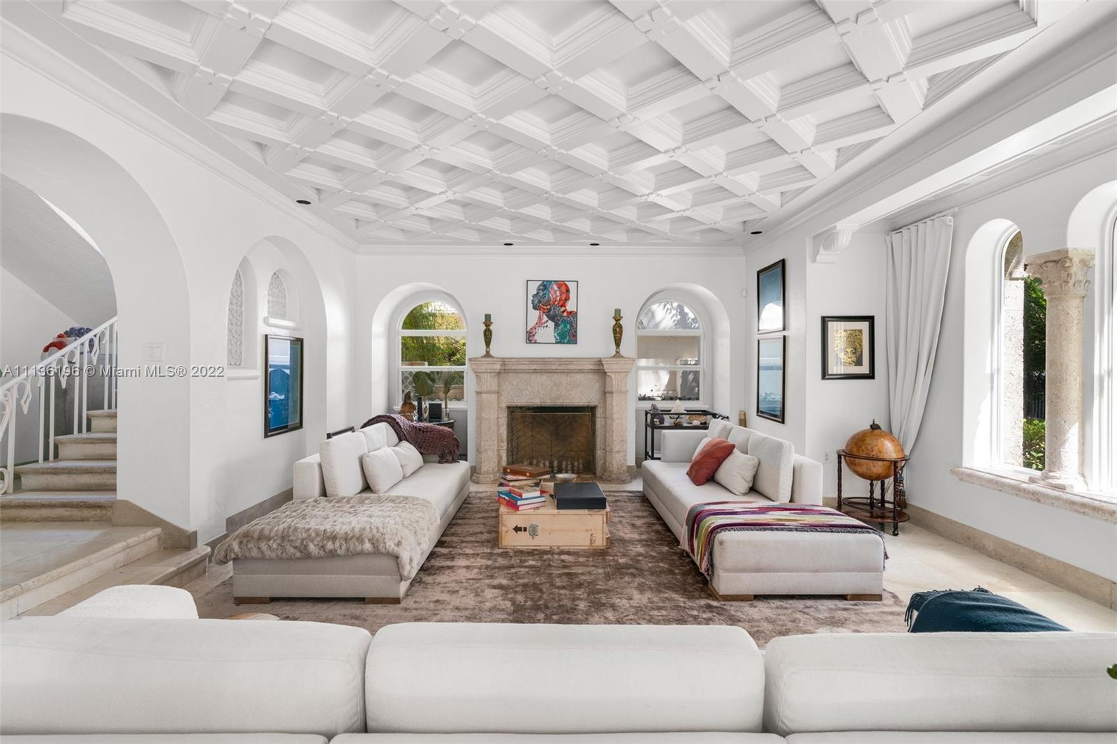 5852 Pine Tree Drive Miami Beach, FL 33140 - Photo 5 of 53 a living room with furniture and a fireplace