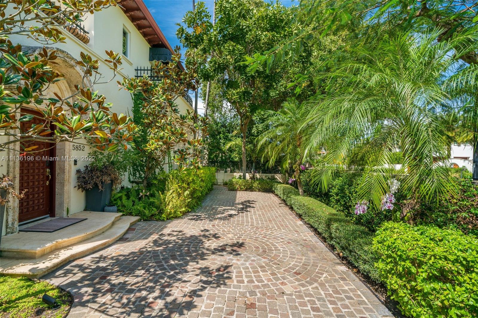5852 Pine Tree Drive Miami Beach, FL 33140 - Photo 51 of 53 a view of a pathway both side of yard