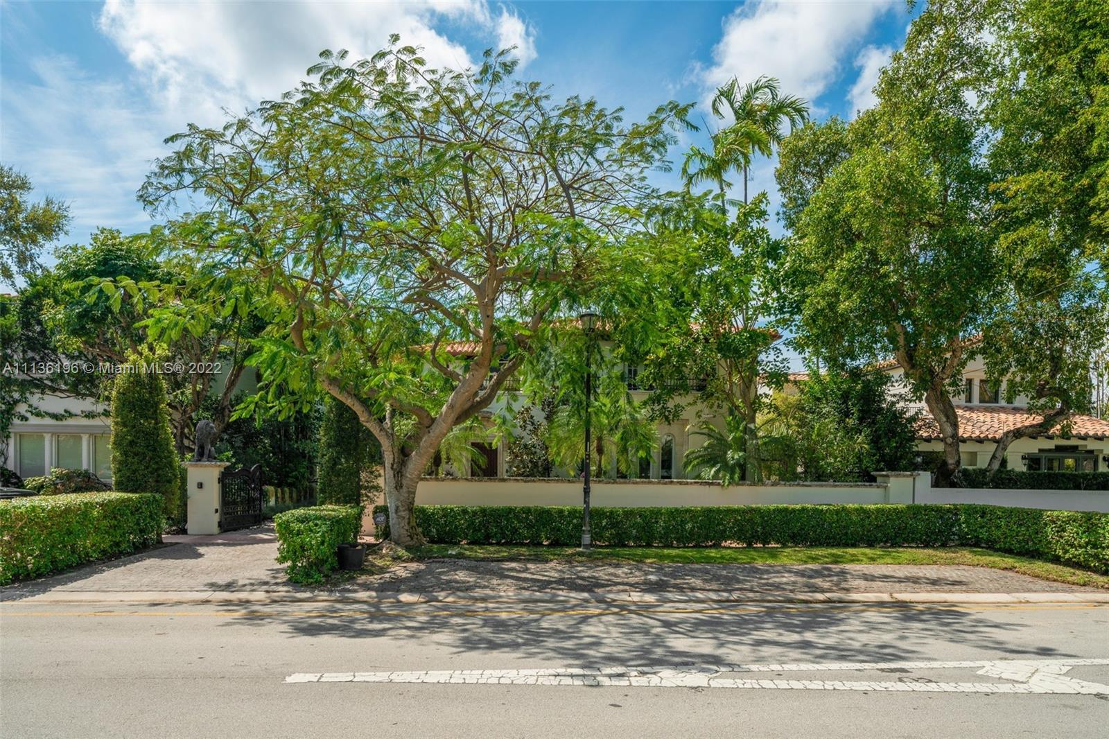 5852 Pine Tree Drive Miami Beach, FL 33140 - Photo 53 of 53 a view of a house with a tree in the background