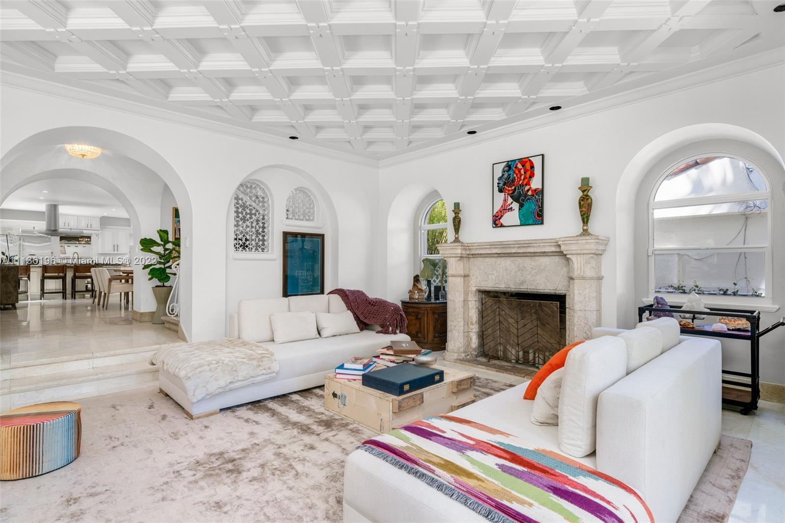 5852 Pine Tree Drive Miami Beach, FL 33140 - Photo 7 of 53 a living room with furniture and a fireplace