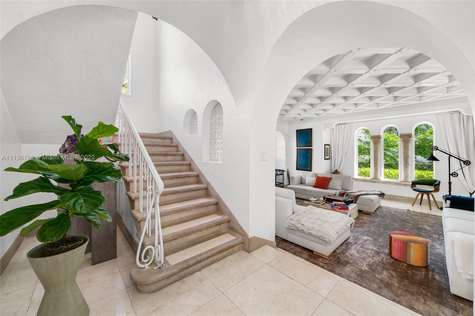 5852 Pine Tree Drive Miami Beach, FL 33140 - Photo 8 of 53 a living room with furniture and a potted plant
