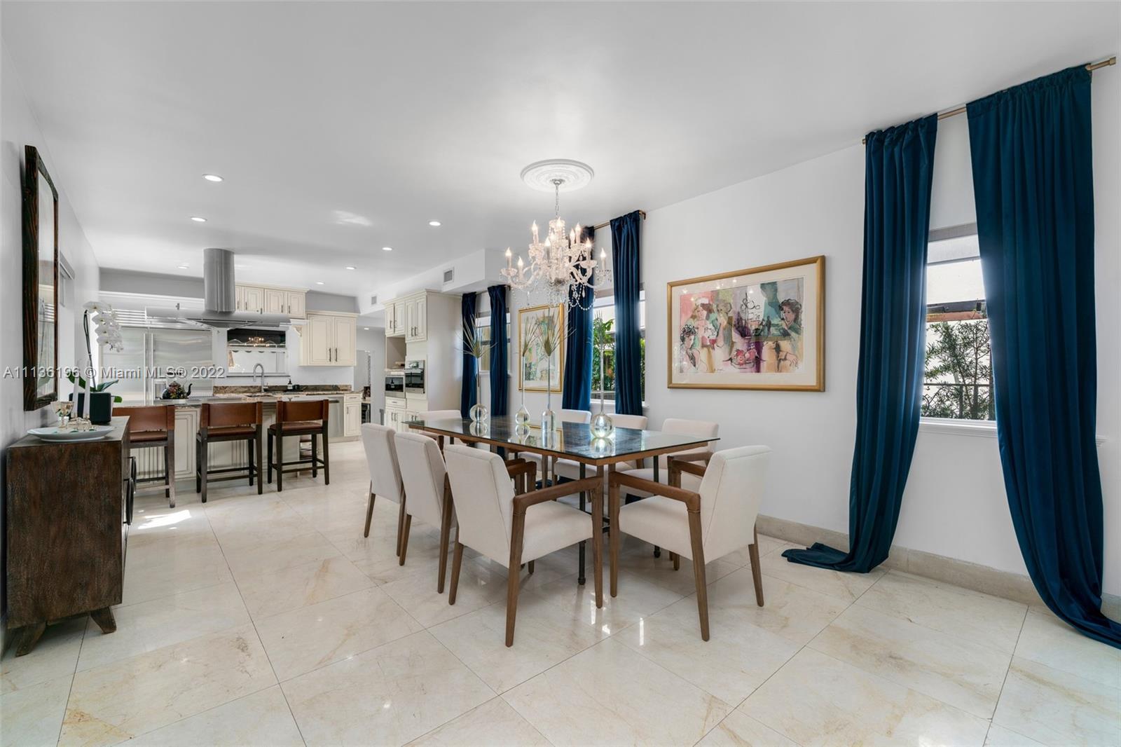 5852 Pine Tree Drive Miami Beach, FL 33140 - Photo 9 of 53 a view of a dining room with furniture window and outside view