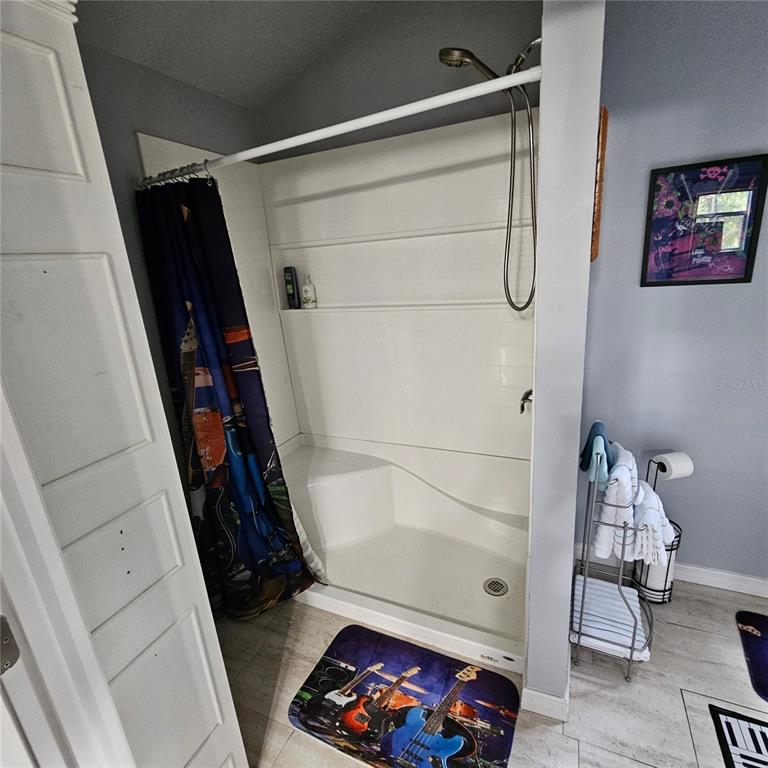 1255 Black Bear Ranch Trail Pierson, FL 32180 - Photo 11 of 13 a bathroom with a bathtub and shower