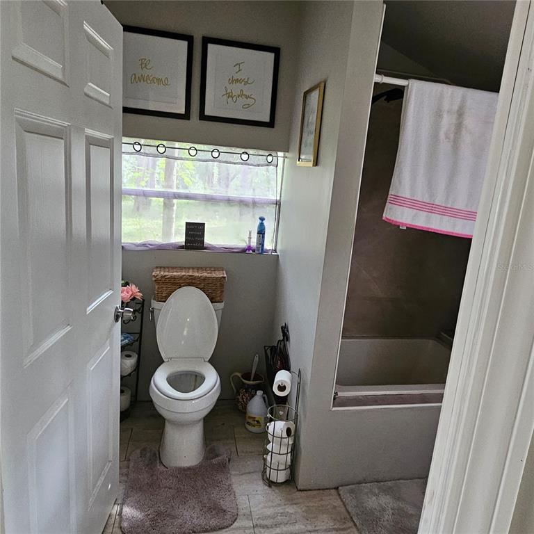 1255 Black Bear Ranch Trail Pierson, FL 32180 - Photo 3 of 13 a bathroom with a toilet and a shower