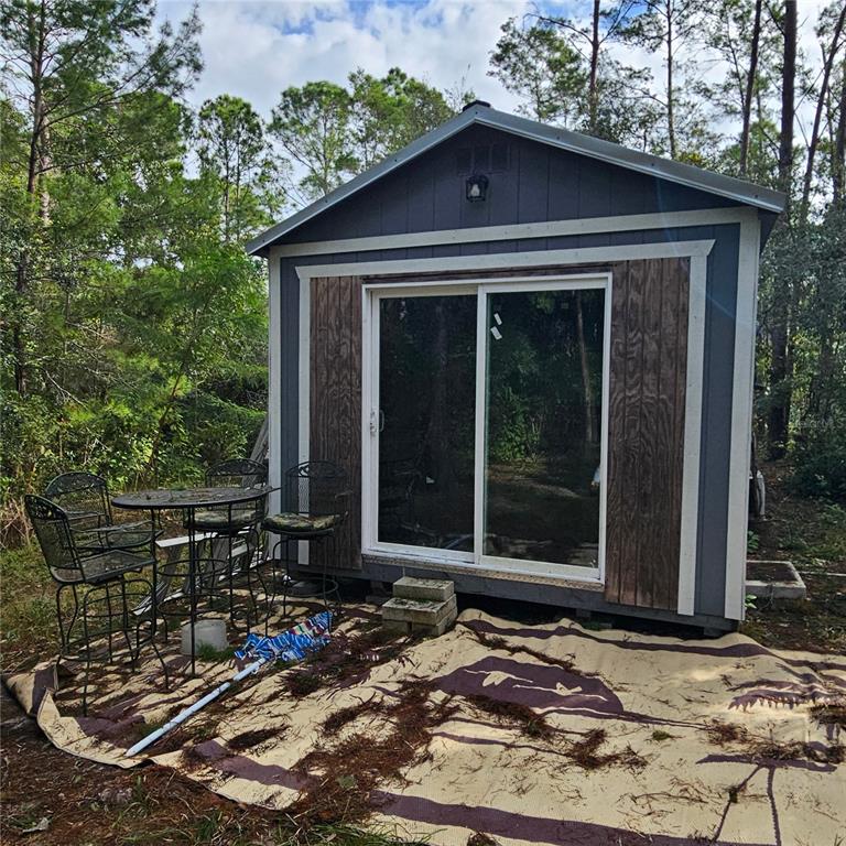 1255 Black Bear Ranch Trail Pierson, FL 32180 - Photo 8 of 13 a front view of a house with garden