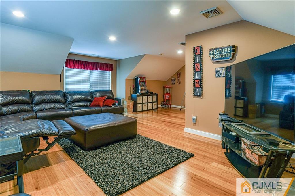 85 Davidson's Mill Road North Brunswick, NJ 08902 - Photo 38 of 39 a living room with furniture and a flat screen tv
