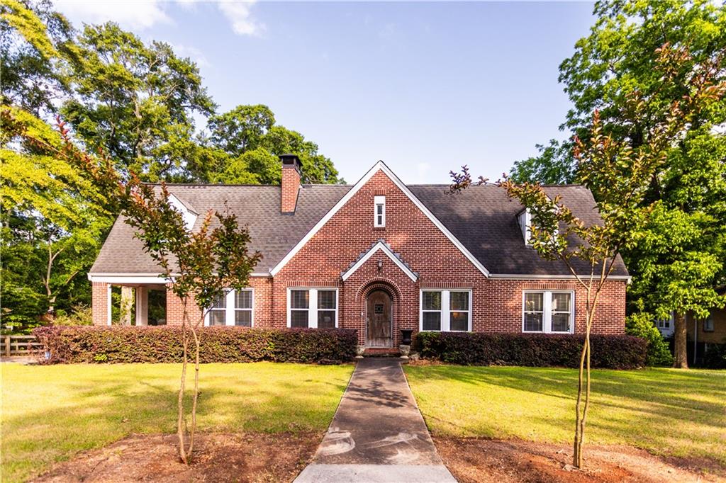 346 North Cherokee Road Social Circle, GA 30025 - Photo 1 of 71 a front view of a house with swimming pool