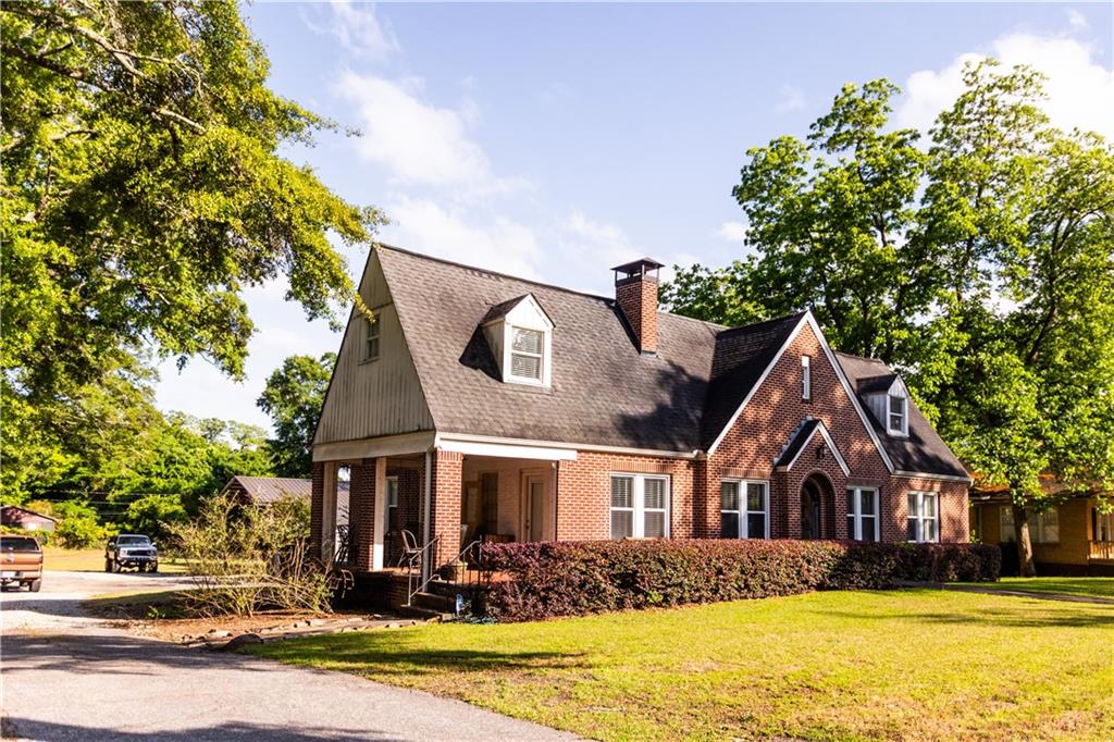 346 North Cherokee Road Social Circle, GA 30025 - Photo 2 of 71 a front view of house with yard and trees around