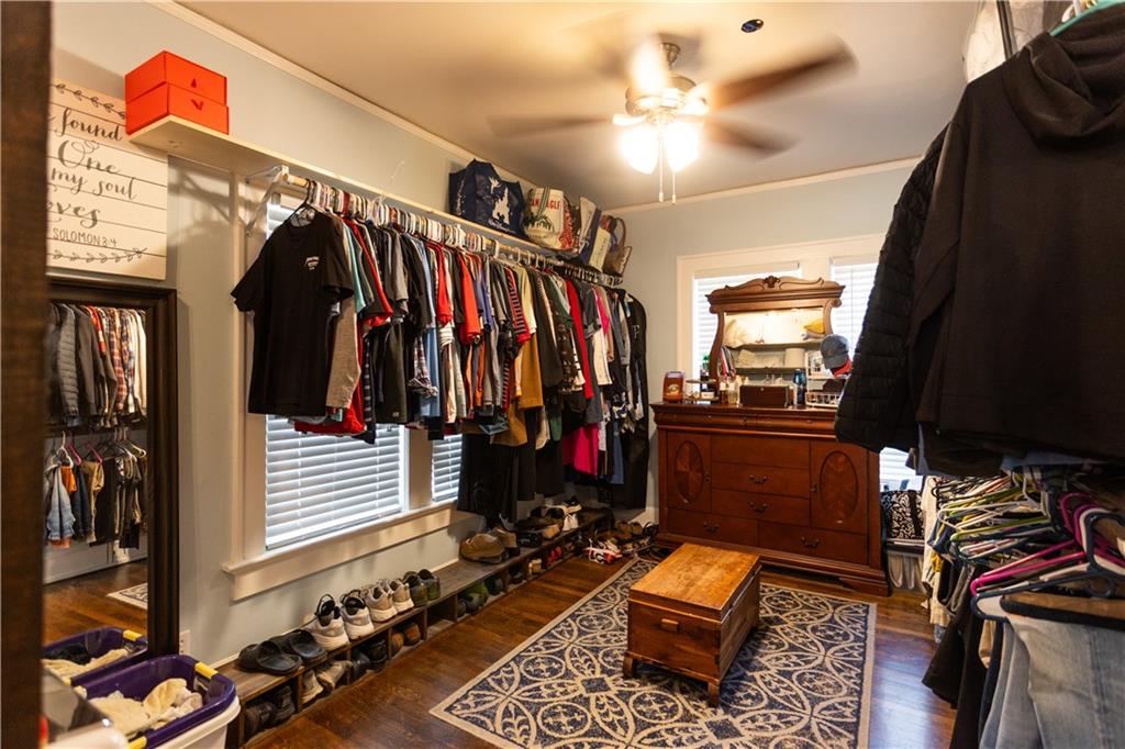 346 North Cherokee Road Social Circle, GA 30025 - Photo 25 of 71 a view of walk in closet with clothes and shoes
